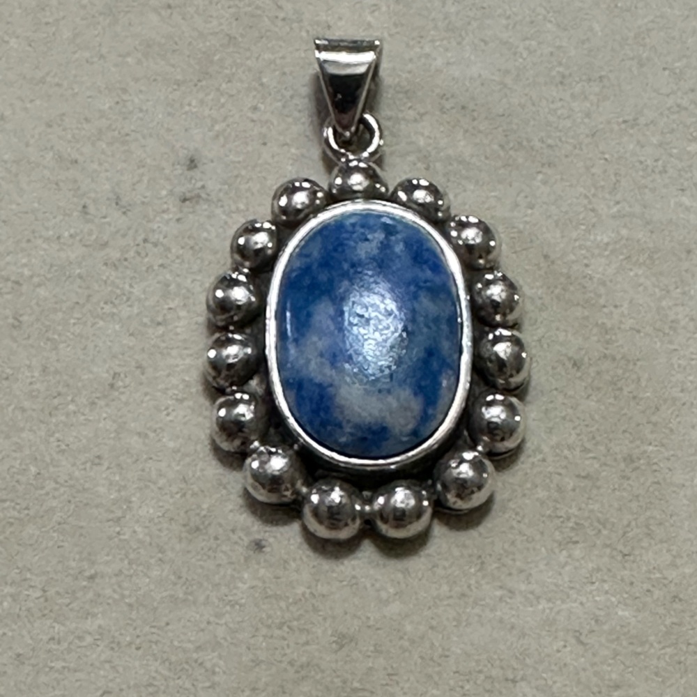 Vintage sterling silver oval pendant with lapis stone.